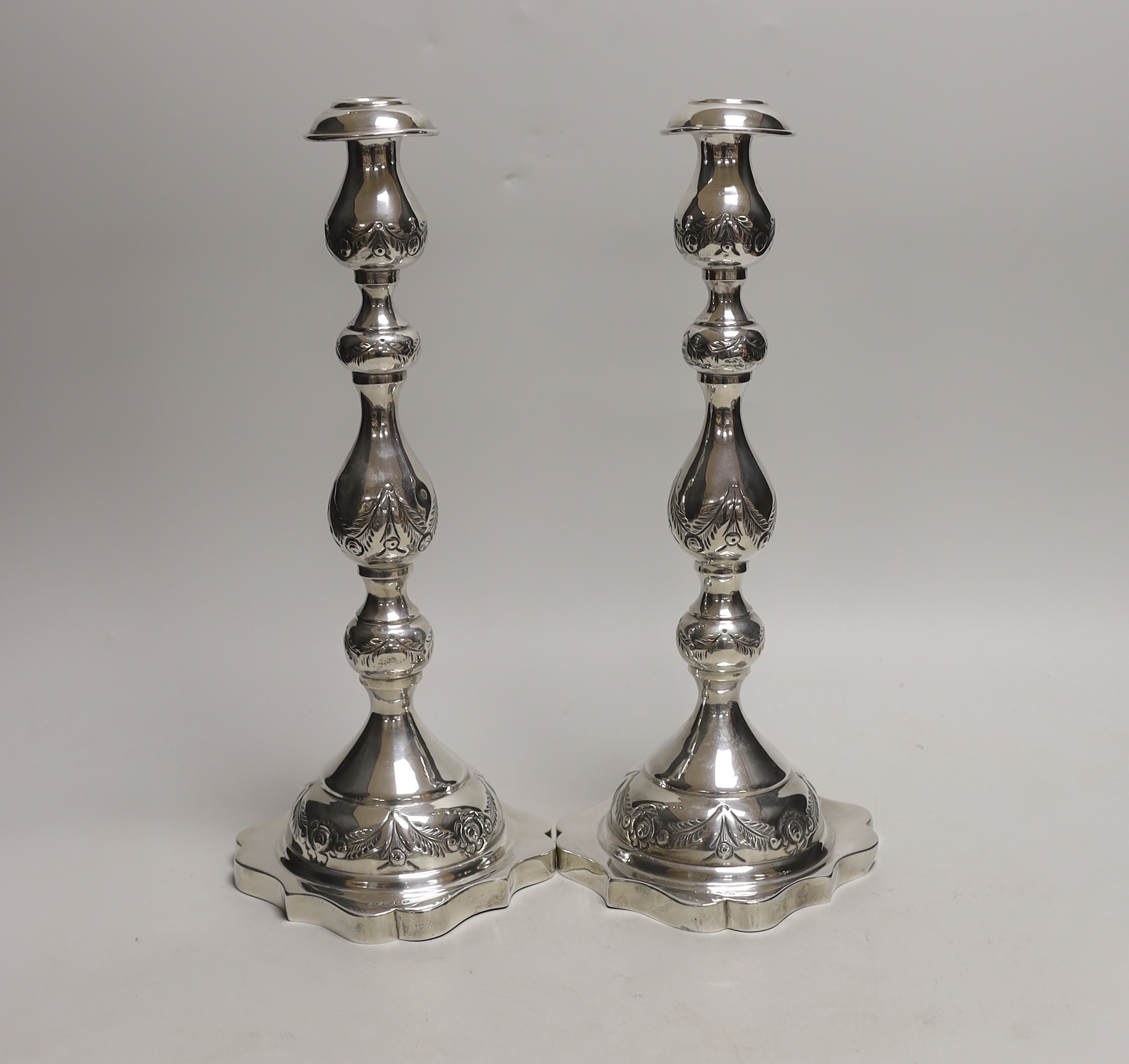 A pair of George V silver Sabbath Day candlesticks, Rosenzweig, Taitelbaum & Co, London, 1930, 34cm, 20oz.